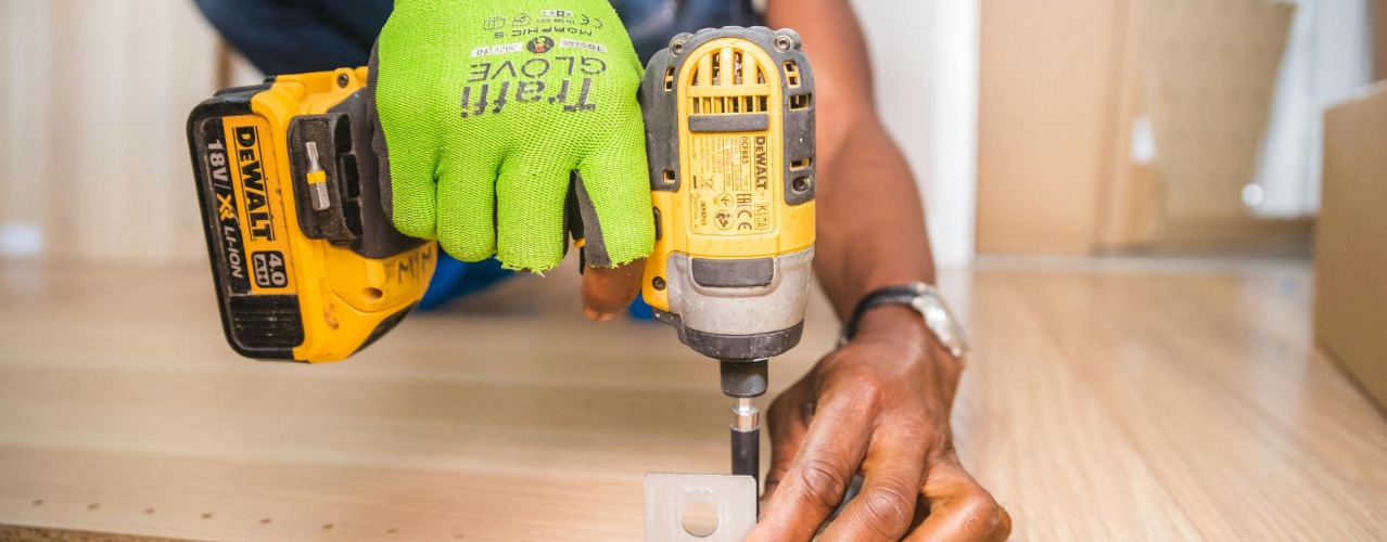 construction worker with drill in hands