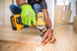 construction worker with drill in hands